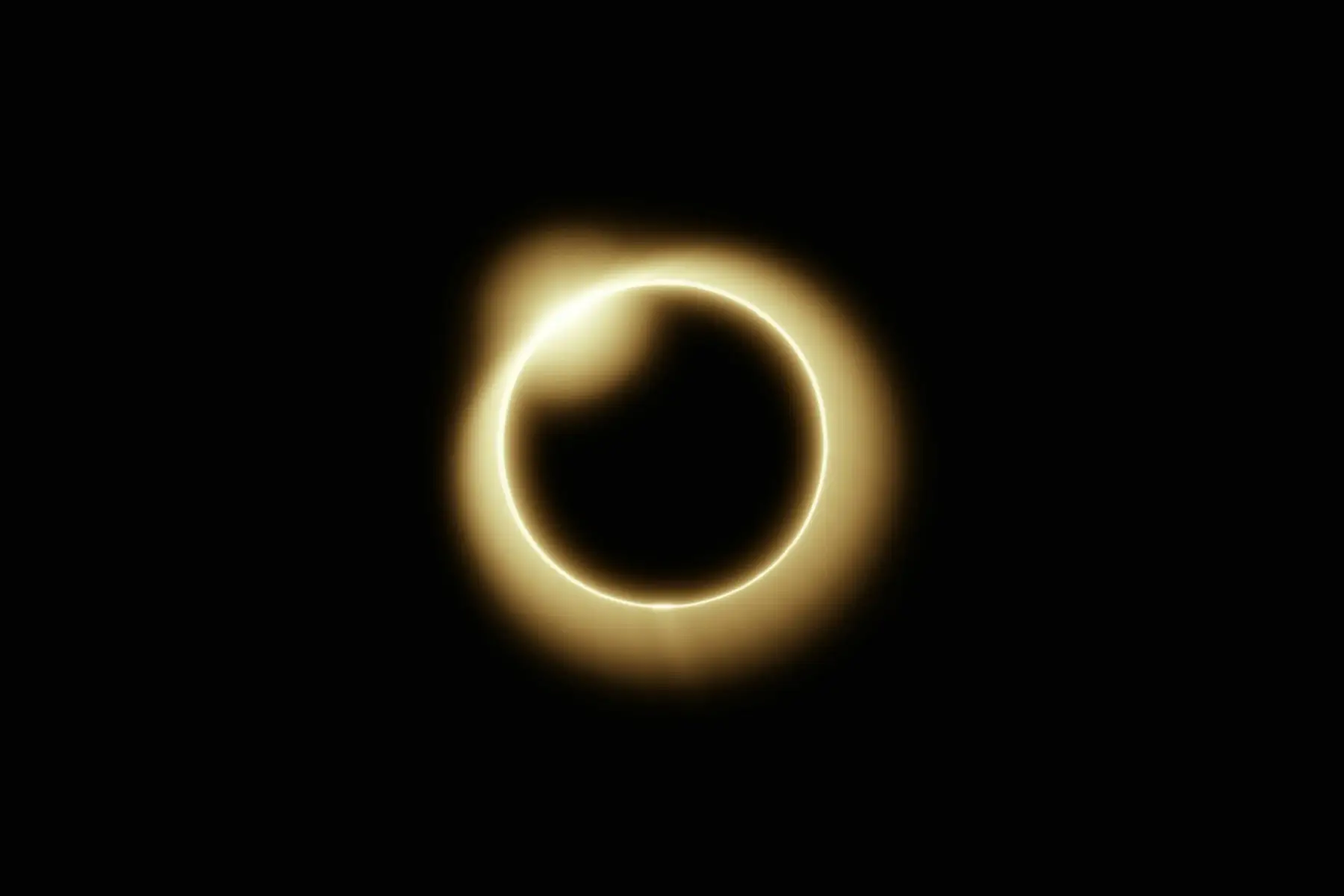A solar eclipse: the moon covering the sun, with a glowing ring around it