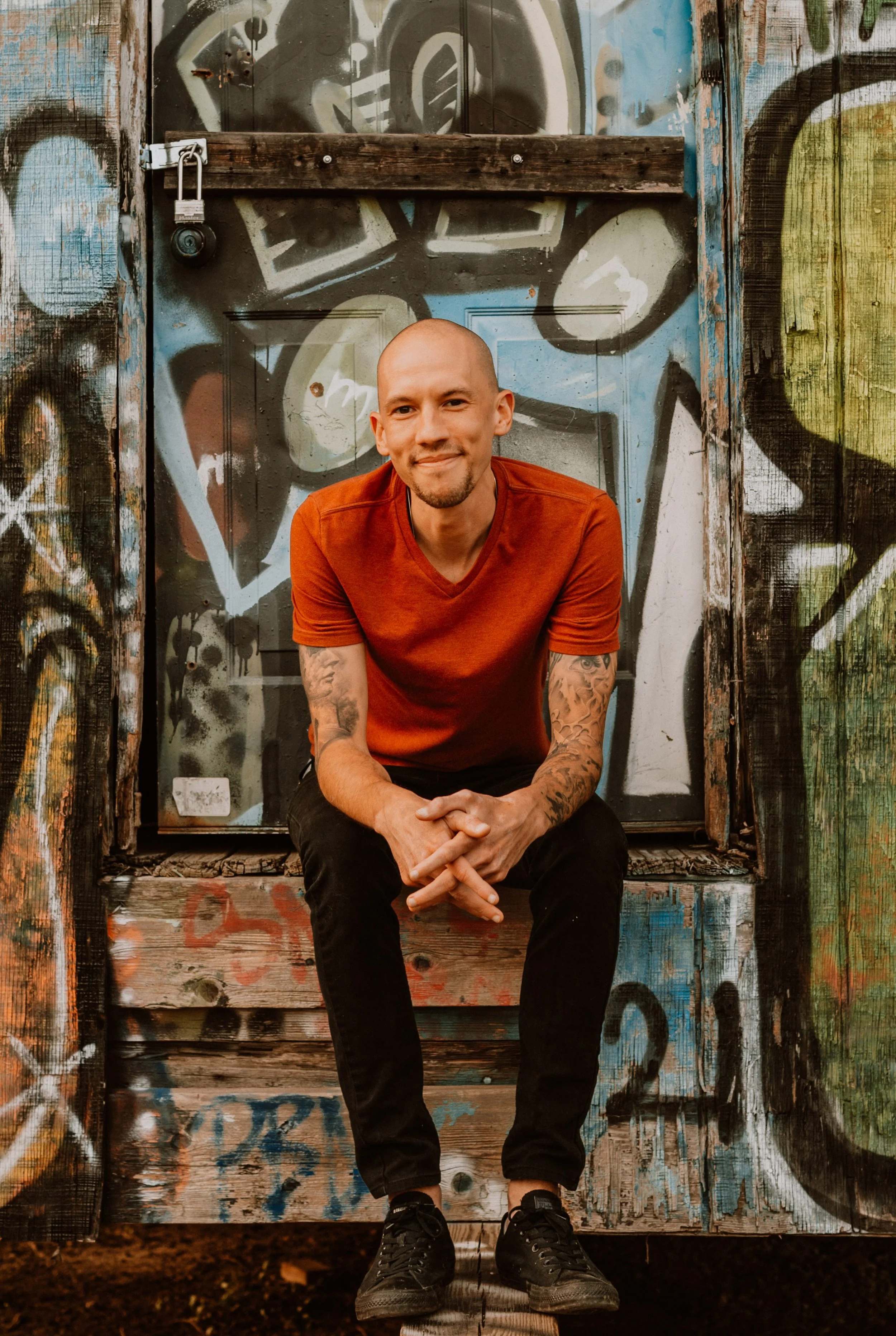 Zack Kampf sitting outdoors, depth psychotherapist and Pacifica faculty